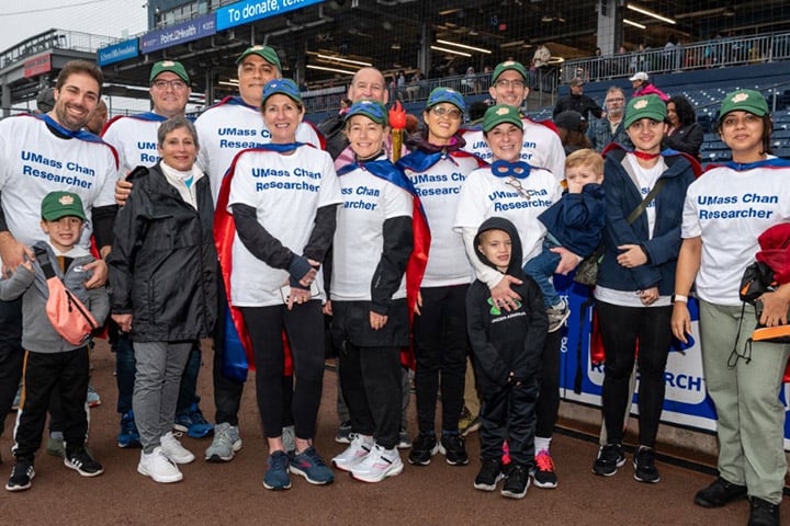 UMass Cancer Walk co-founder Dottie Manning joins UMass Chan researchers for a photo.