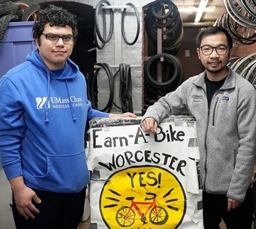 medical students helping community bike program