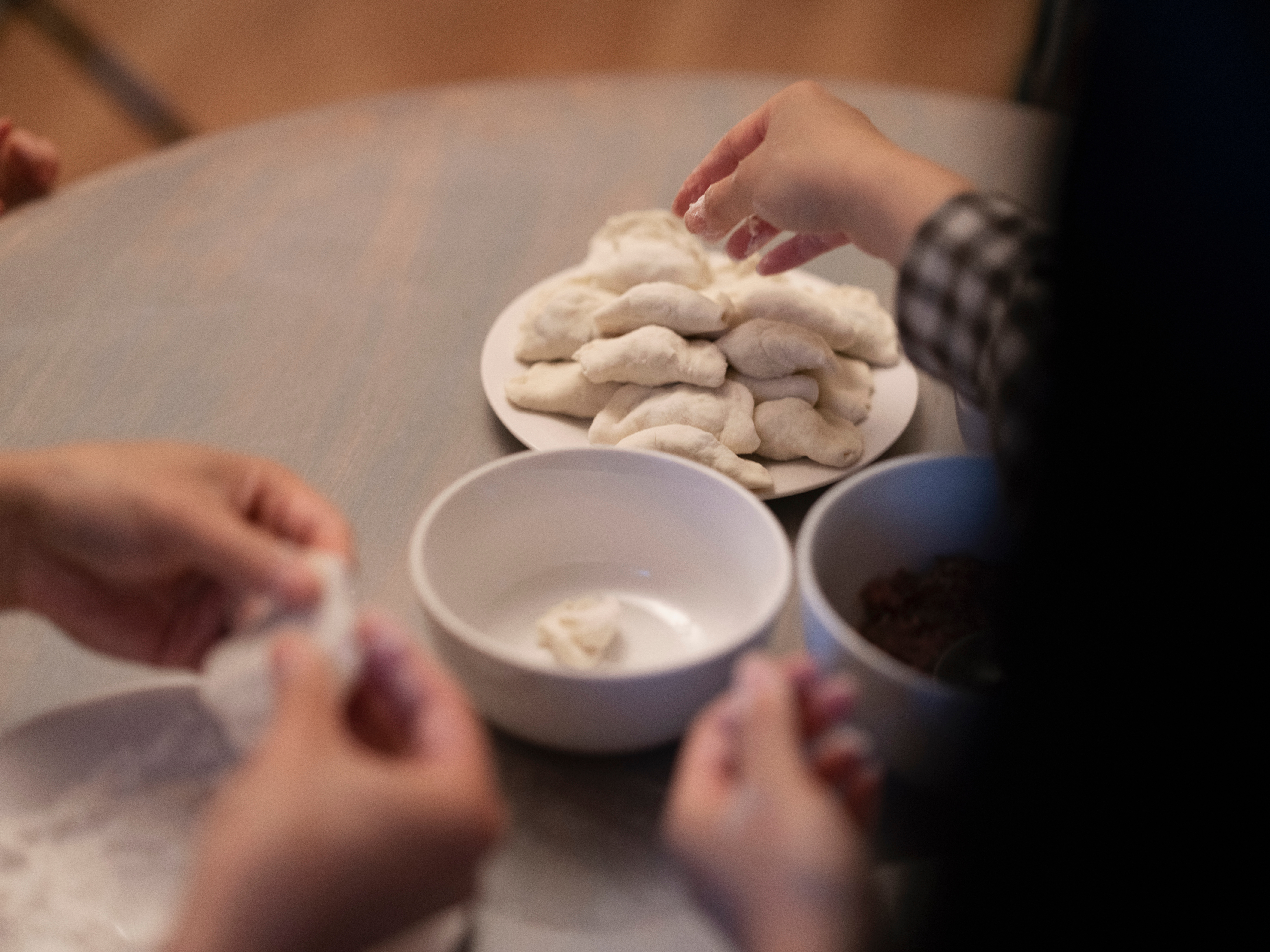 Image of a person making dumplings