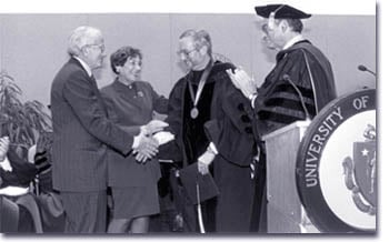 Irving and Betty Brudnick congratulate Anthony Rothschild, MD, the newly inaugurated Irving S. and Betty Brudnick Chair in Psychiatry, as UMMS Chancellor and Dean Aaron Lazare, MD, looks on.