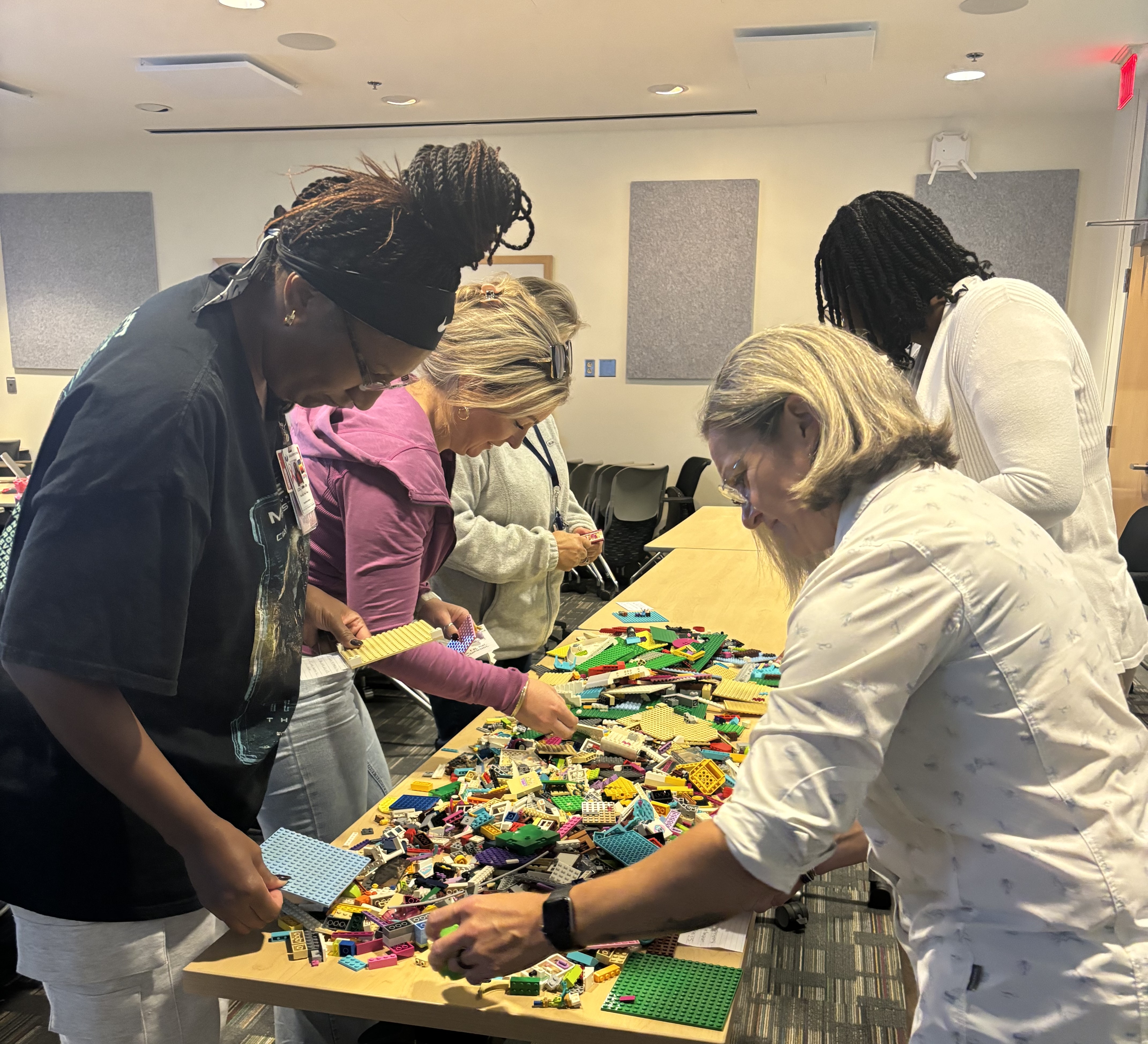 Masters Interprofessional Nursing students engaging with innovation/design thinking activity using LEGOs