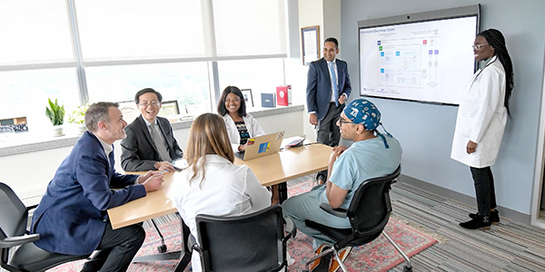 faculty and trainees in conference room