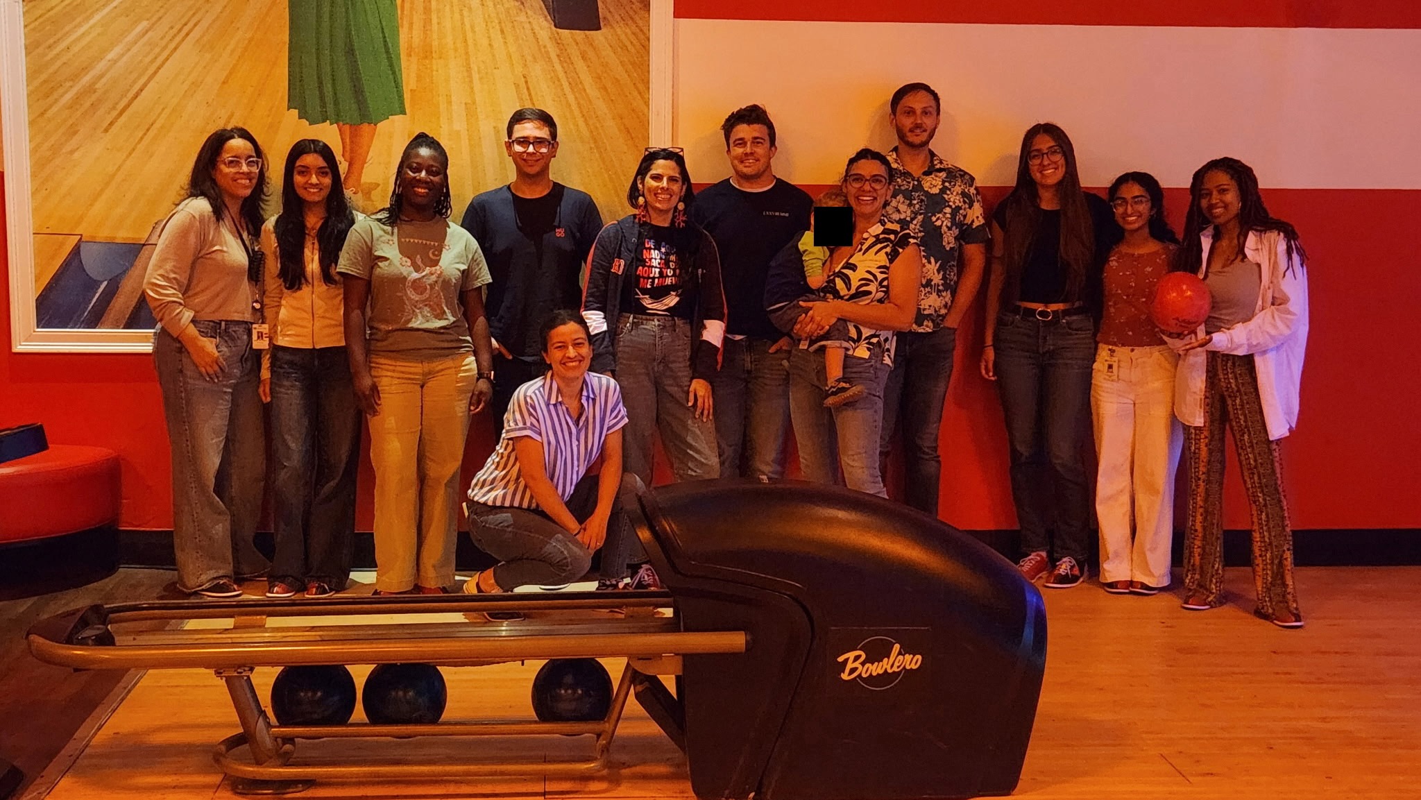Galvan Pena and Maldonado labs pose for a photo while bowling