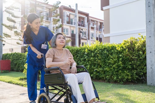 ALS impacts woman's mobility; pictured in wheelchair