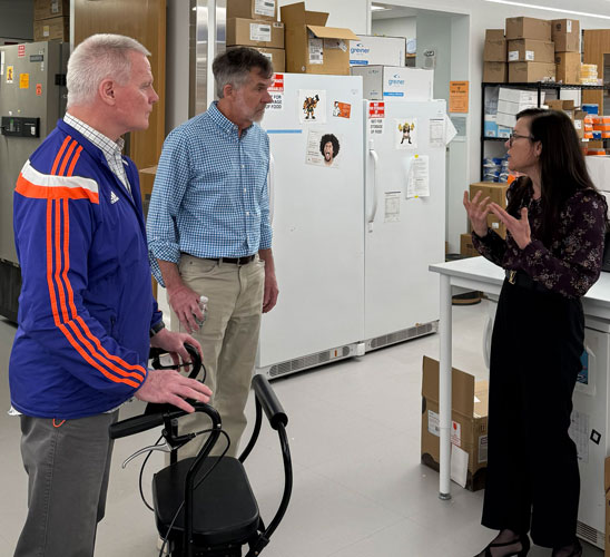 Lab tour photo with Daryl Bosco discussing initiatives with guests from The Angel Fund