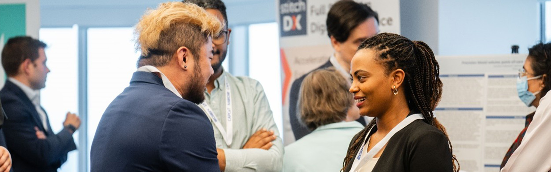 Image of Heaven Tatere speaking to a guest at a CAPCAT event
