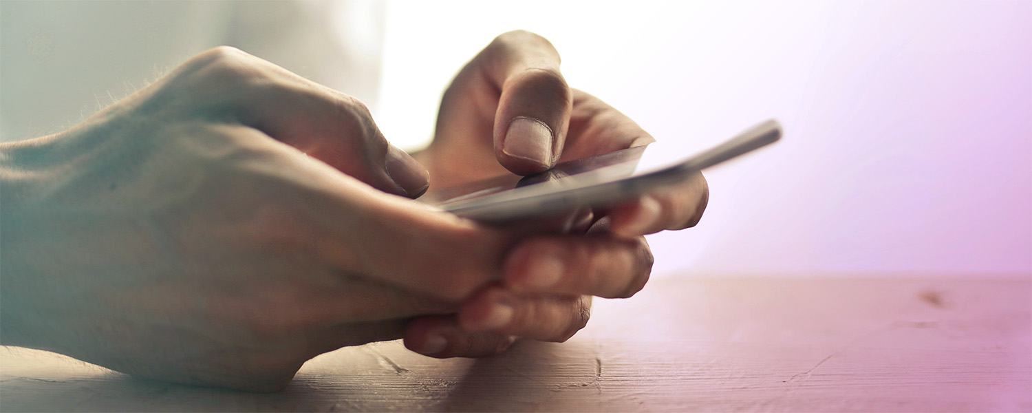 Hands holding phone