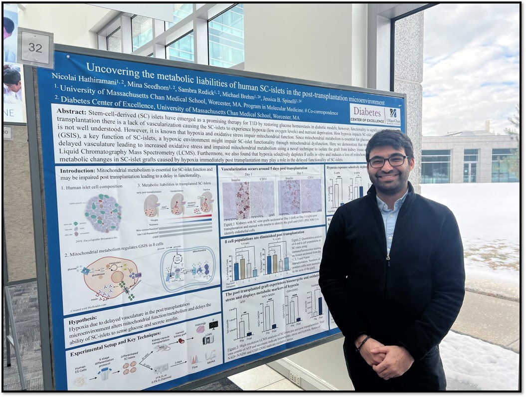 PhD student presenting at a poster session