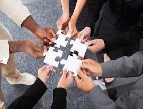  bigstock-Businesspeople-Holding-Jigsaw--63248317_resized.jpg