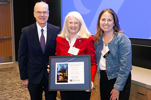 Mary-Ellen Taplin, MD'86 celebrates with Dean Flotte and Alumni Association President Meg Brackley, MD’00.