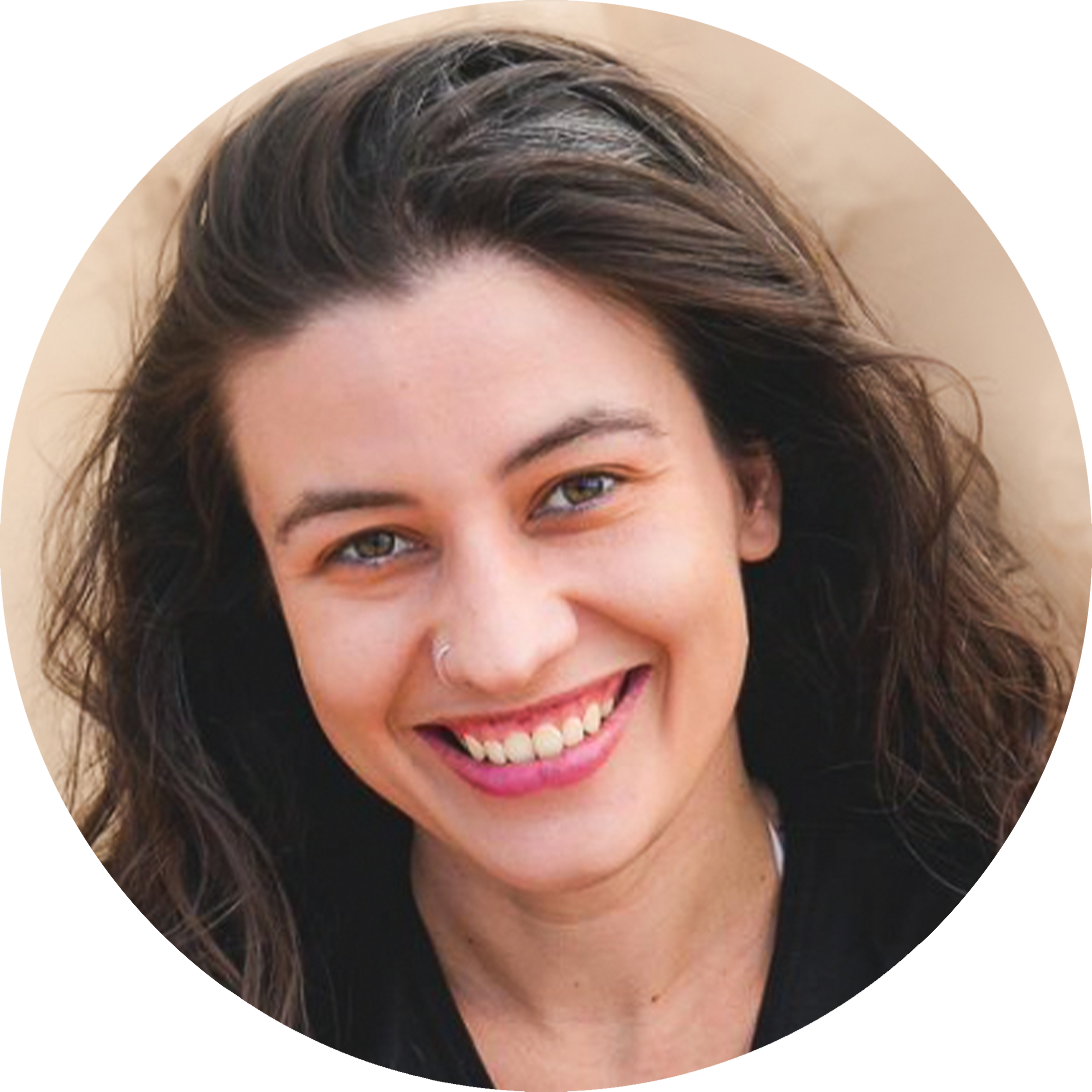 A headshot of Galvan Pena Silvia with a broad and warm smile. She has a long wavy dark hair and wears a small nose ring. 