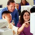 Image of students looking at computers