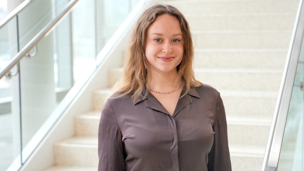 Emma Vanderleeden standing next to staircase
