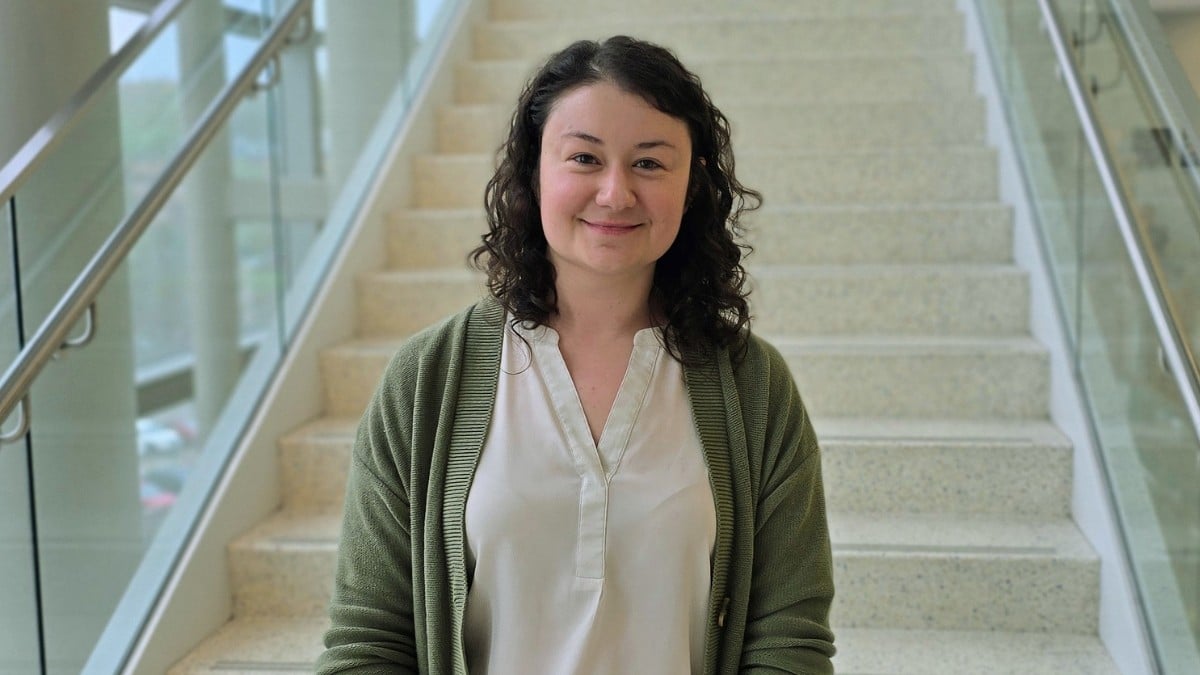 Lauren Majors standing next to staircase