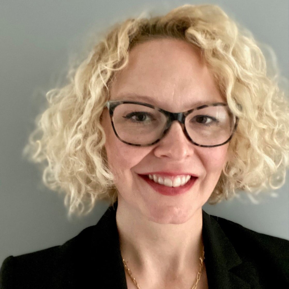white middle aged woman with curly blonde hair