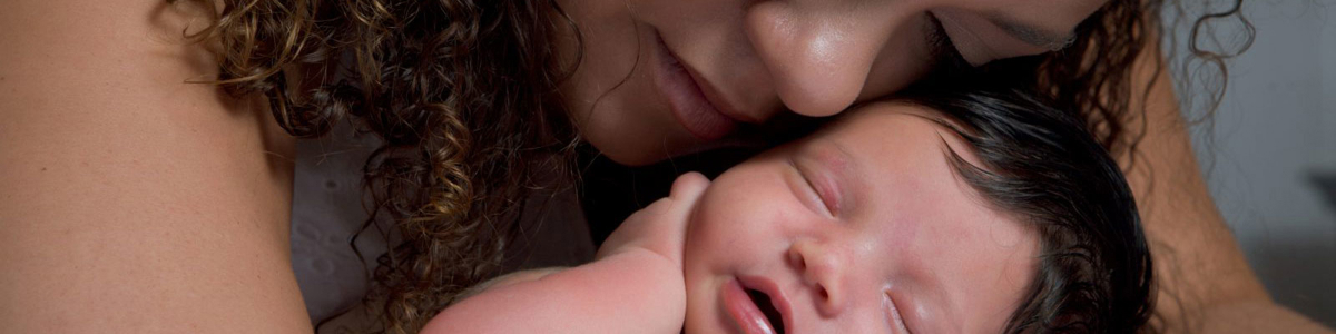 A-mother-comforting-her-newborn-baby.jpg