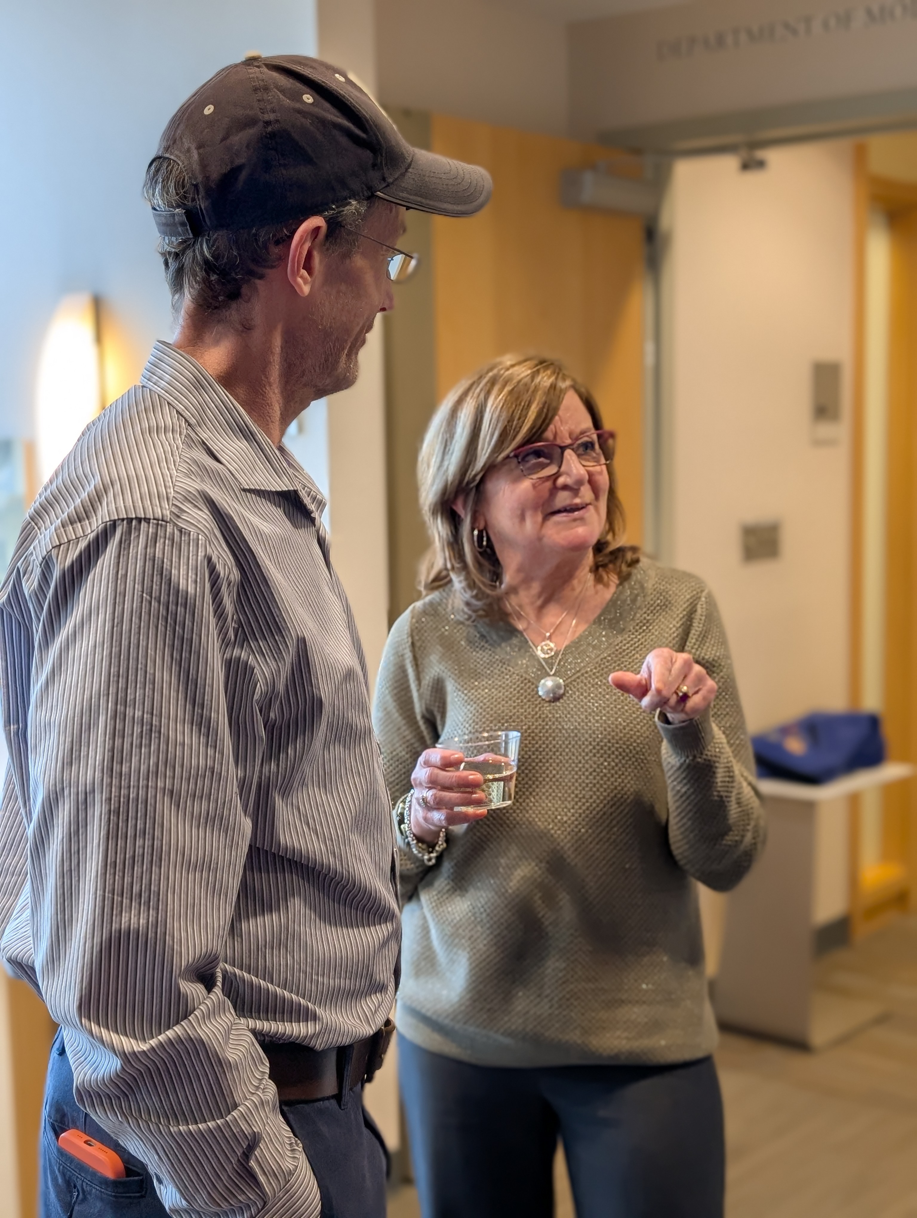 Judy Mondor in conversation with attendees at her retirement celebration.