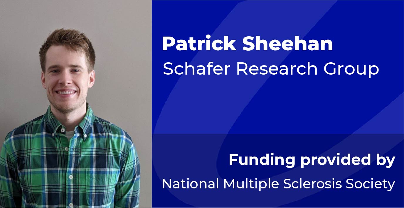 A researcher stands beside a blue information panel displaying the text: “Patrick Sheehan, Schafer Research Group. Funding provided by National Multiple Sclerosis Society.”