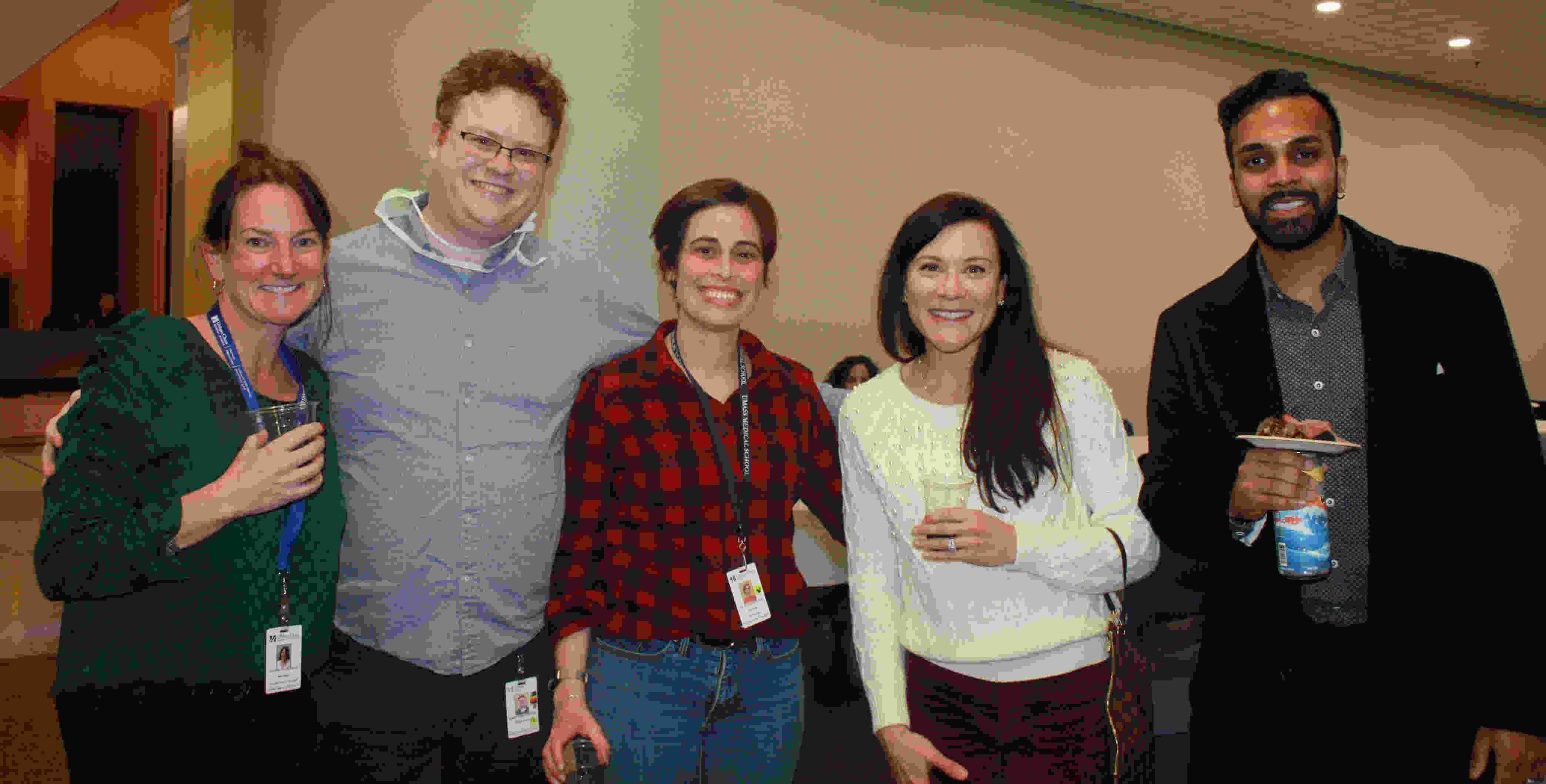 multiple guests mingling at neurology holiday party