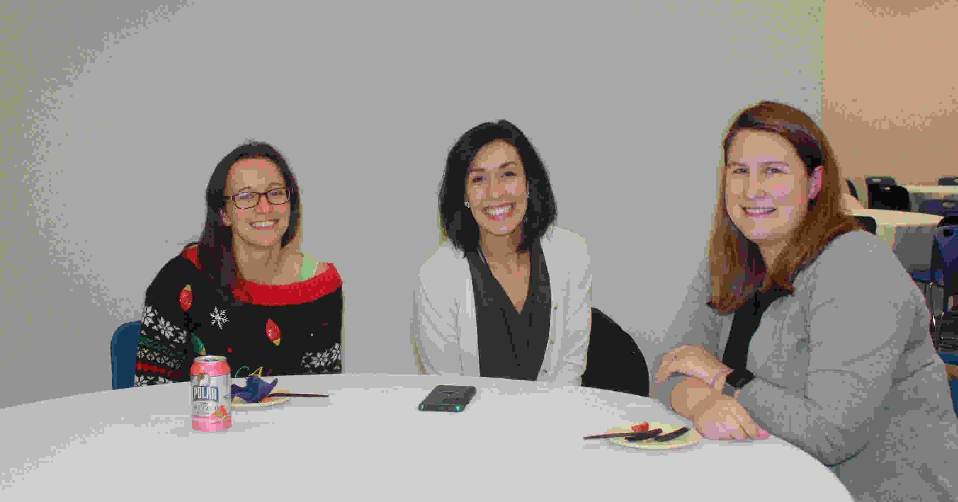 neurology team members collaborate around a table