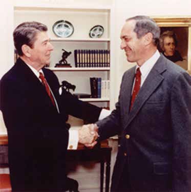 David Drachman, MD, shaking hands with President Ronald Reagan