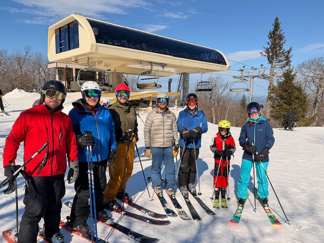 Radiology residents pose on ski slope