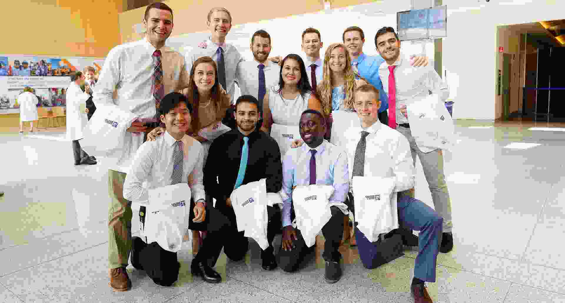 Group white coat in lobby resized.jpg