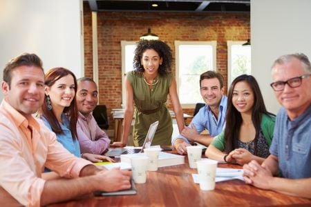 group of people around a table problem solving