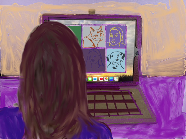 woman with brown hair sitting at a laptop