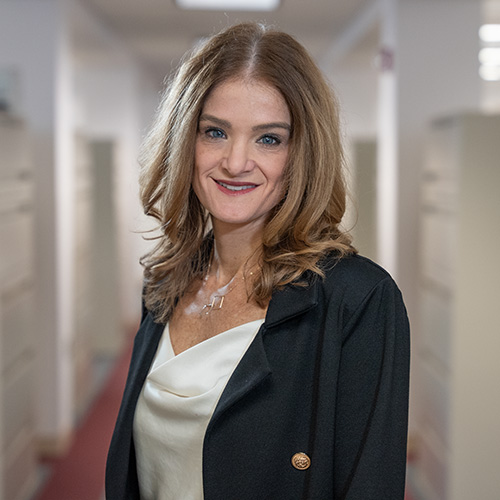 white middle aged woman with long dark blonde hair
