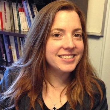 white woman with brown hair smiling