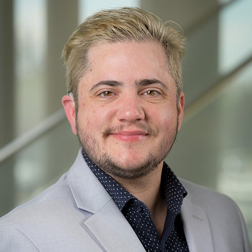 white man with blonde hair smiling