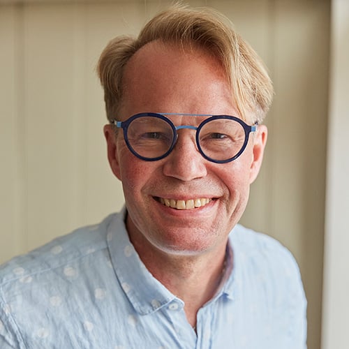 white man blonde hair and glasses