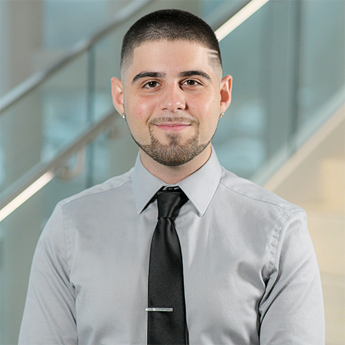 white man black buzz cut with goatee