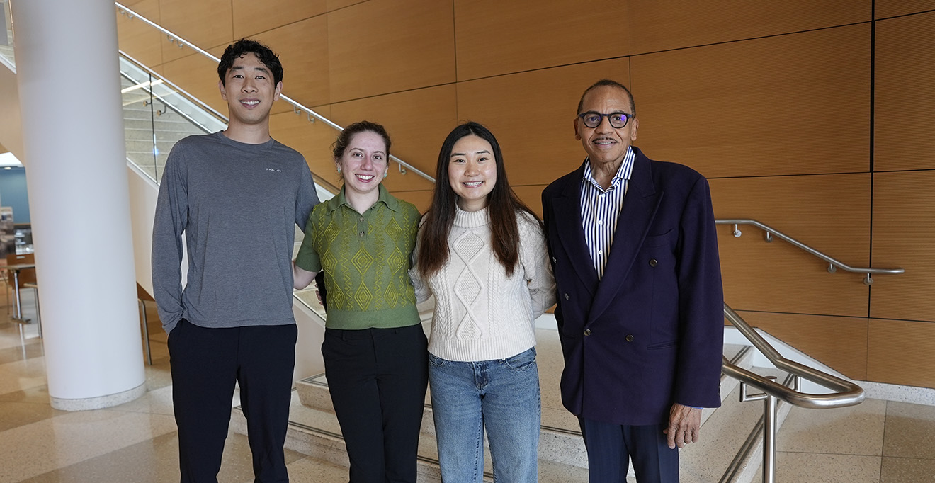 From left: First-year medical students Carter Liou, Sydney Warshaw and Grace Zhou with Robert Layne