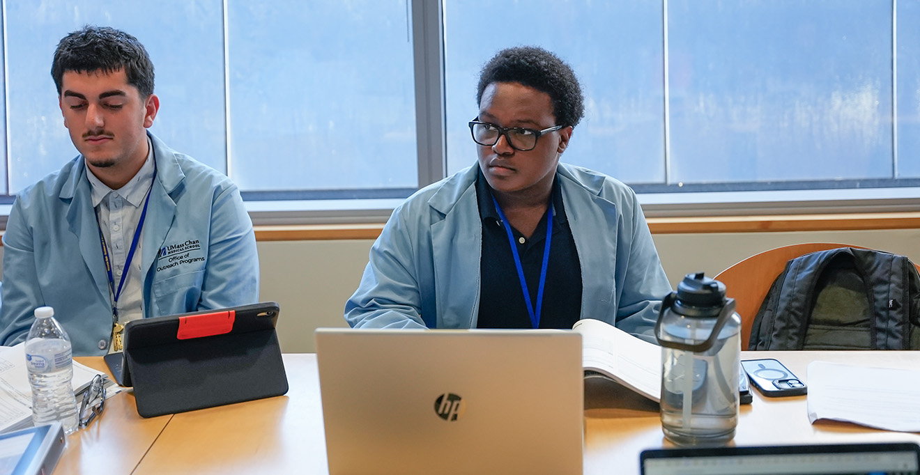 Kieran Wangai, a rising senior at Minuteman High School in Lexington, Massachusetts, listens during a math class in the High School Health Careers Program