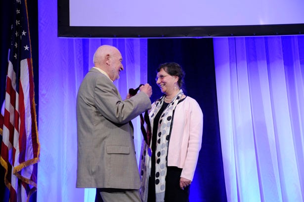 Mel Cutler presents Vivian Budnik, PhD, with the medallion for the Worcester Foundation for Biomedical Research Chair.