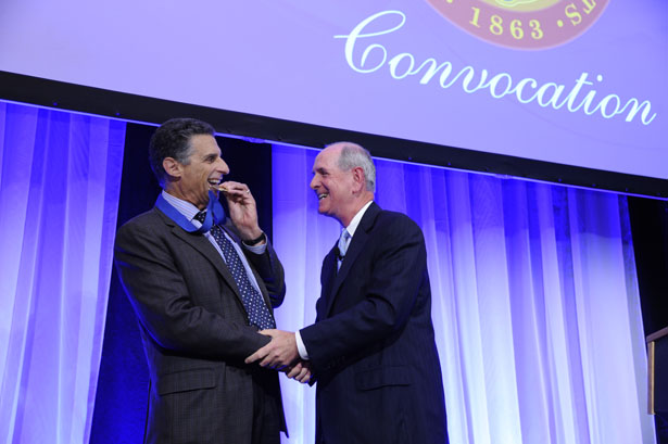 David Clive, MD, recipient of the 2014 Chancellor’s Medal for Distinguished Teaching, shares a light moment with Chancellor Collins.