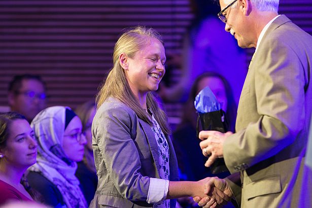 Rachel Stamateris is congratulated by the dean.