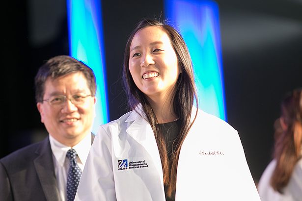 Elizabeth Chan dons her new white coat.