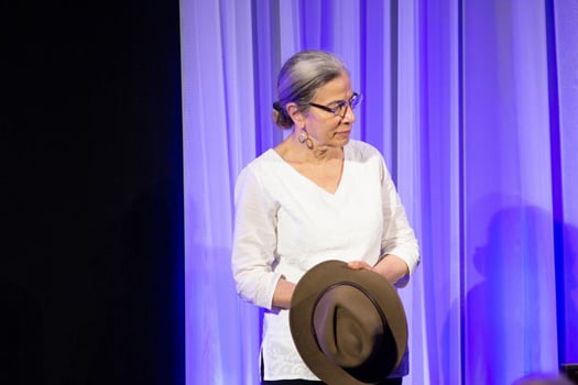 Joyce Fingeroth, MD, holds the hat of her late husband, Robert Finberg