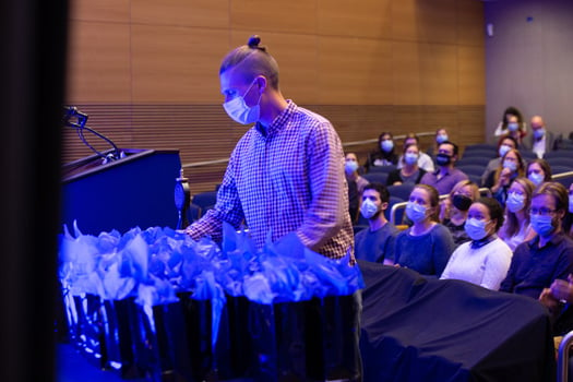 Students received a gift bag containing business cards and a laser pointer, a tradition that dates to 2013.