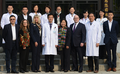 Richard Forster, Melissa Fischer, Luanne Thorndyke and Lan Qin stand with colleagues at a medical education conference in China.