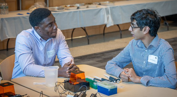 Photo of Shadrack Frempong of Boston working with a partner during the lab activity at &ldquo;What the Heck is Biotech?&rdquo;