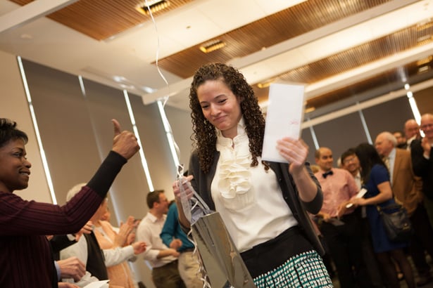 Alessandra Moore takes the last envelope and wins the kitty of $1 from each classmate. She is headed to a general surgery residency at Brigham & Women’s Hospital in Boston.