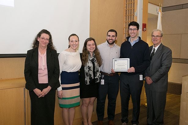 “A Day of Service, A Night of Fun” MLK Semester of Service Award winners stand with Heather-Lyn Haley, PhD, (far left) and Dean Terence Flotte (far right).