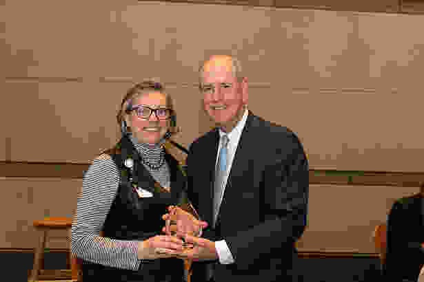 Valerie Wedge accepts the Chancellor’s Award for Advancing Institutional Excellence in Diversity and Inclusion from Chancellor Collins.