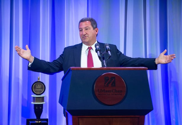 Robert Manning addresses the audience at the Albert Sherman Center auditorium.