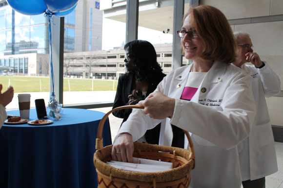 Sonia Chimienti, MD, delivers Match Day envelopes to the learning community mentors.