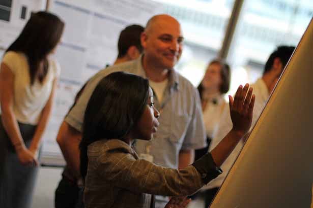 City College of New York senior Latisha Elijio is pictured here with her laboratory host Andreas Bergmann, PhD, professor of cancer biology.